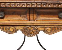 A Spanish Baroque walnut and iron stretcher table, late 17th / 18th century