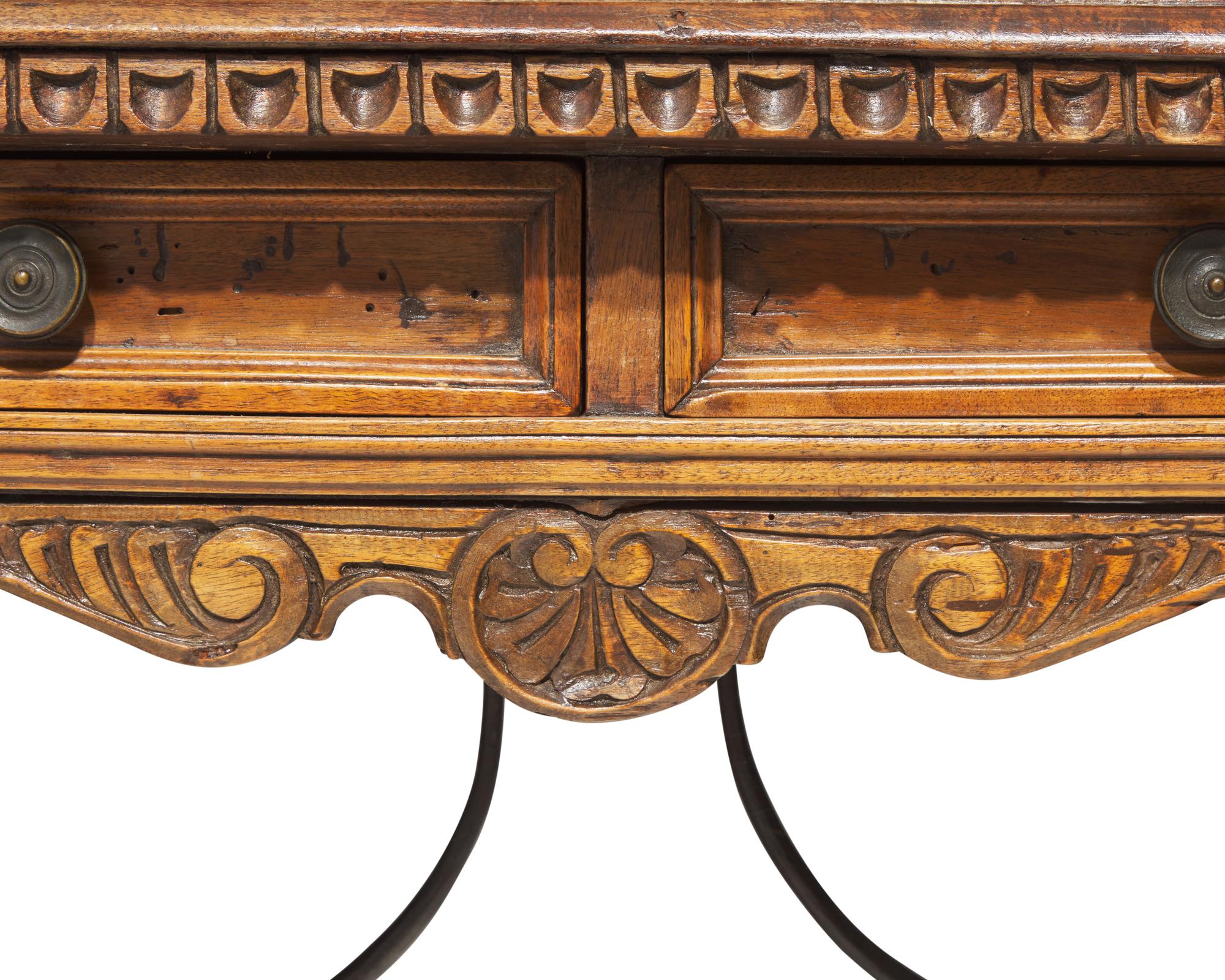 A Spanish Baroque walnut and iron stretcher table, late 17th / 18th century