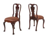 A Pair of Queen Anne Shell-Carved Walnut Pad Foot and Compass Seat Side Chairs