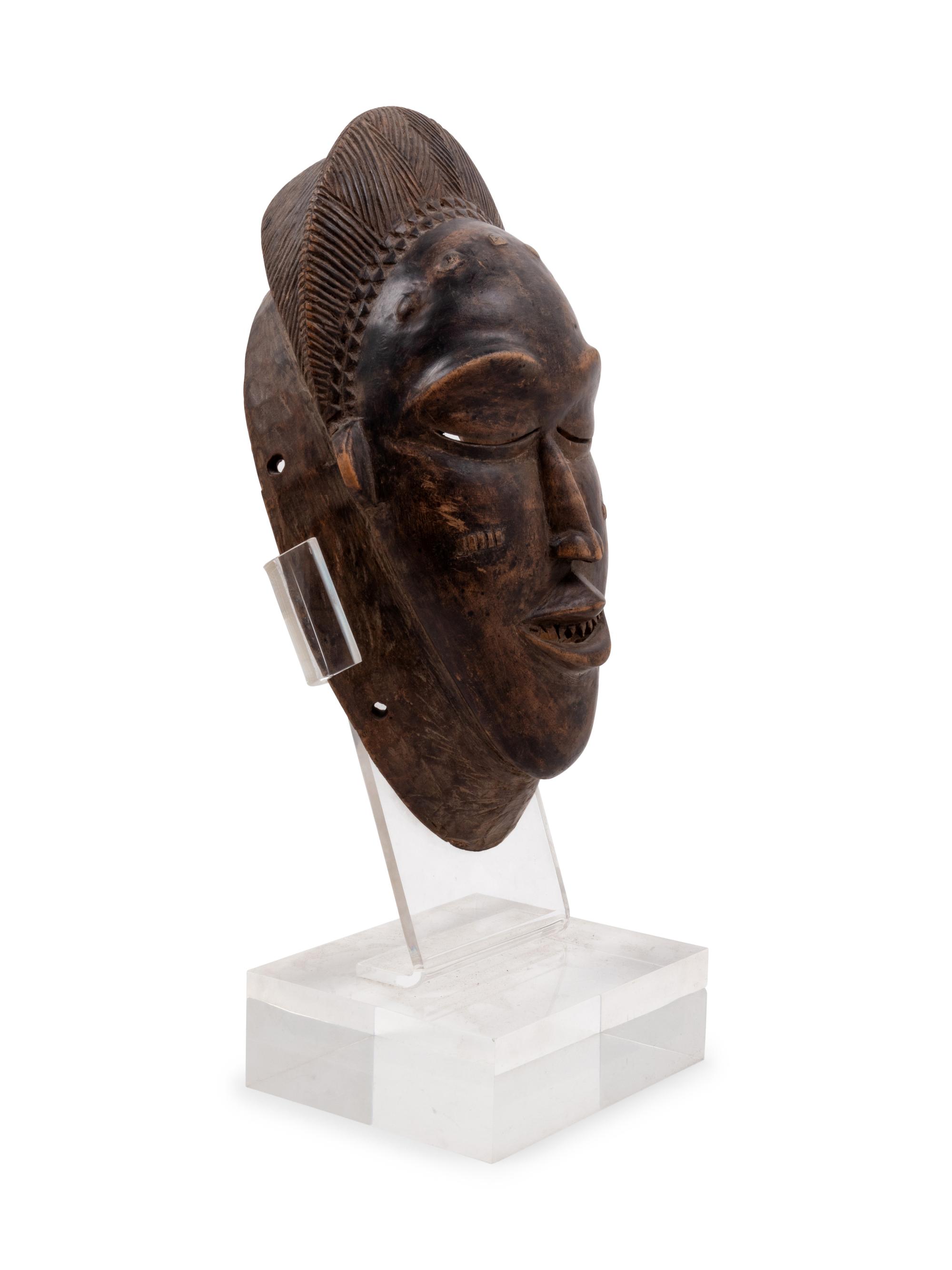 A Baule Style Carved Wood Mask