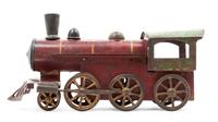 A Tole Model of a Train Engine Length 5 1/2 inches.