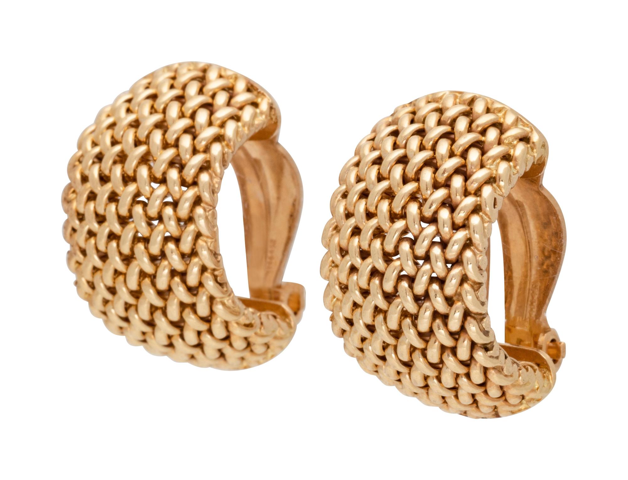 A Pair of 14 Karat Yellow Gold Earclips,