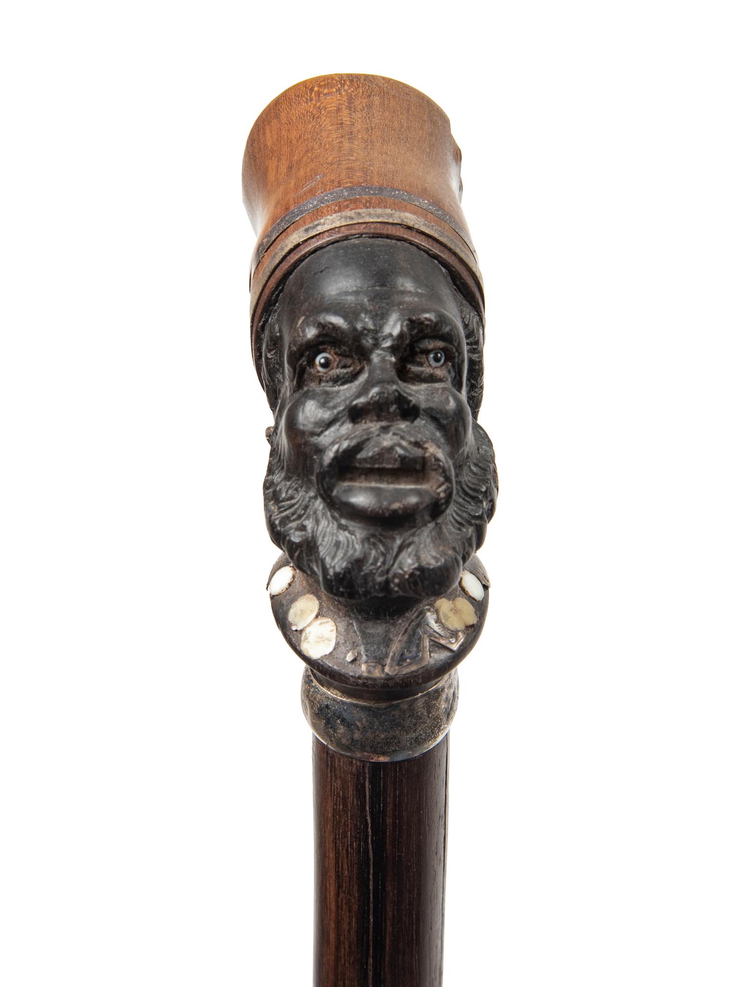 Three Continental Carved Wood Figural Canes