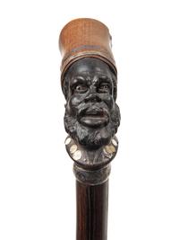 Three Continental Carved Wood Figural Canes