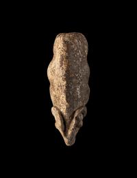 A Near Eastern Marble Figure of a Pregnant Mouflon