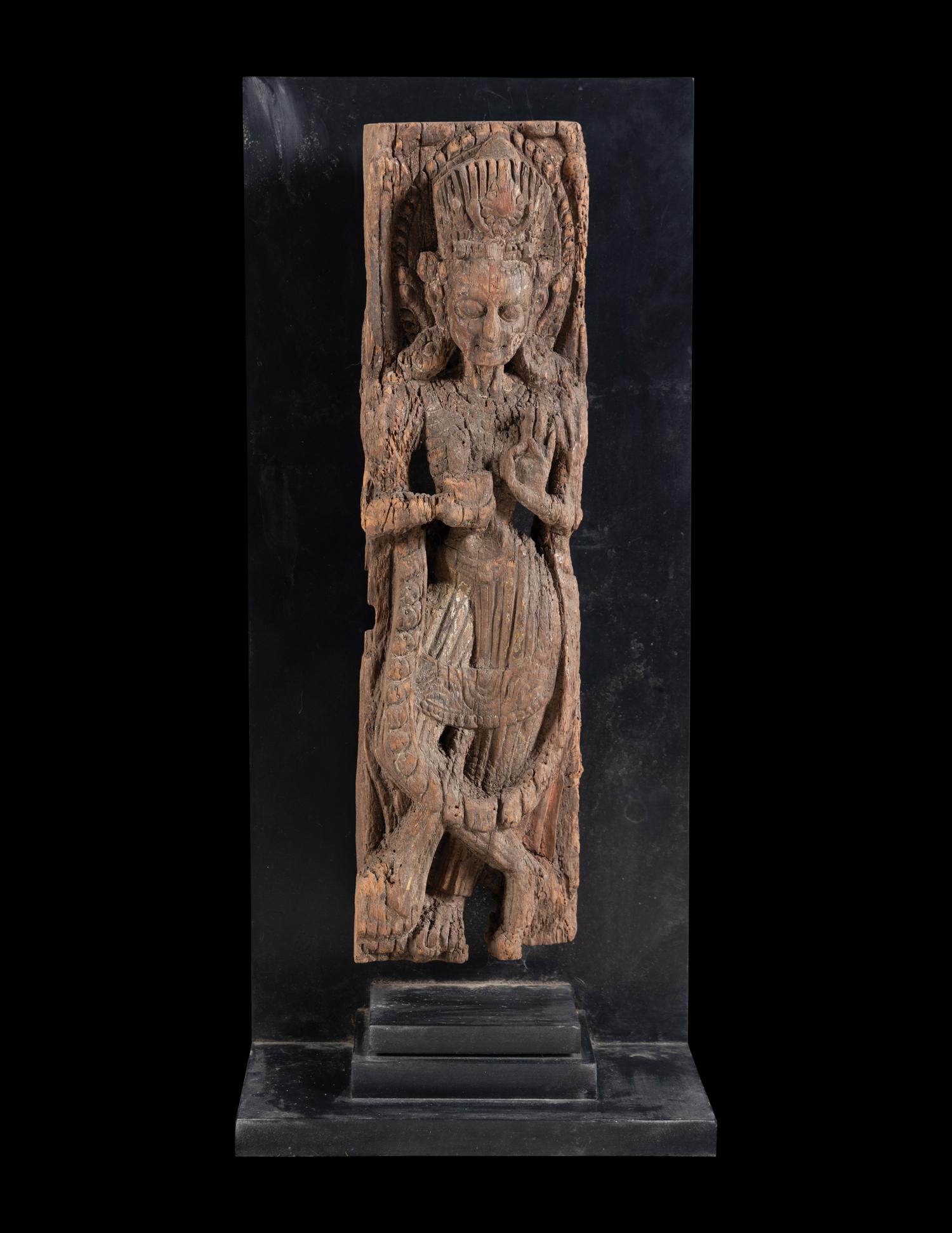 An Indian Carved Wood Figure of a Deity