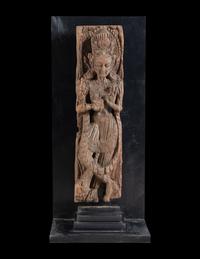 An Indian Carved Wood Figure of a Deity