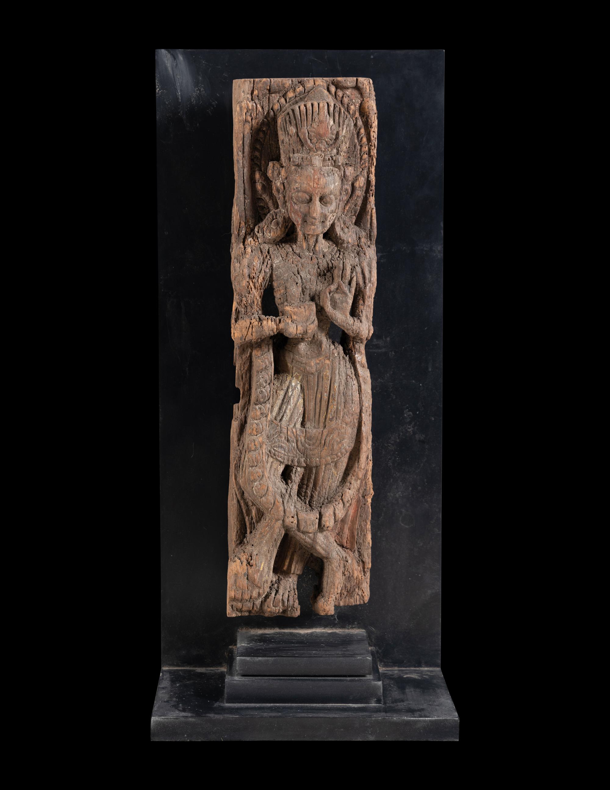 An Indian Carved Wood Figure of a Deity