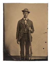 [EARLY PHOTOGRAPHY - TINTYPE]. A group of 4 tintype portraits of civilians with weapons, including: