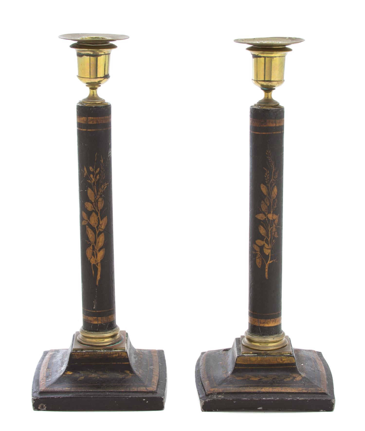 A Pair of Regency Ebonized and Gilt Decorated Candlesticks Height 12 inches. — 19TH CENTURY