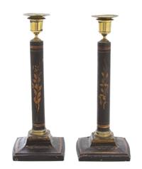 A Pair of Regency Ebonized and Gilt Decorated Candlesticks Height 12 inches. — 19TH CENTURY