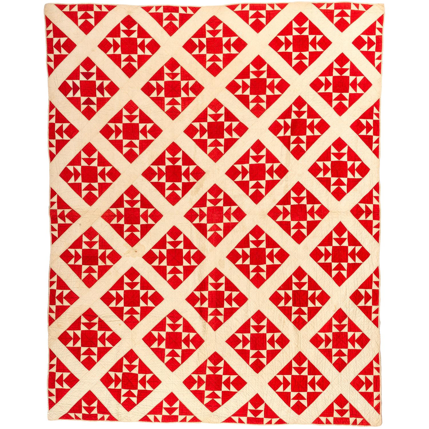 A Red and White Diamond Cross Quilt