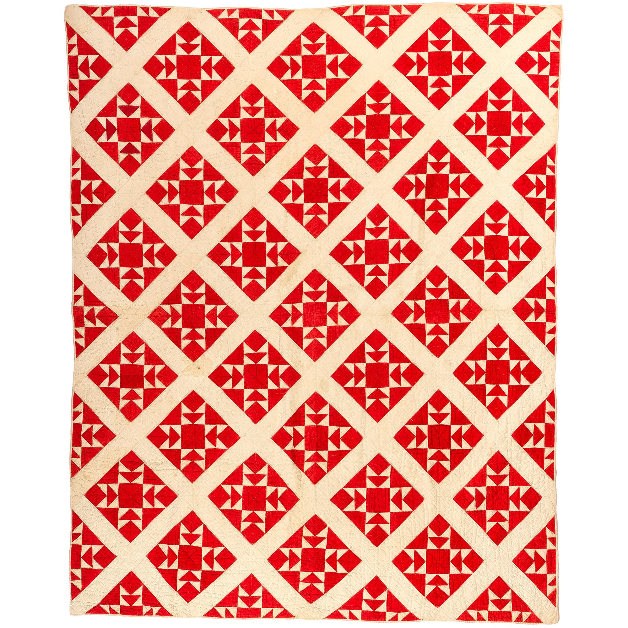 A Red and White Diamond Cross Quilt