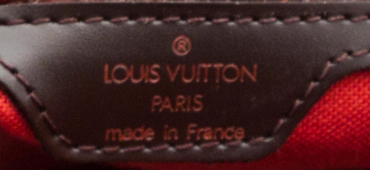 A Louis Vuitton Signature Leather Backpack, 11.5" x 12.5" x 4".