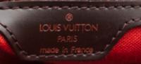 A Louis Vuitton Signature Leather Backpack, 11.5" x 12.5" x 4".