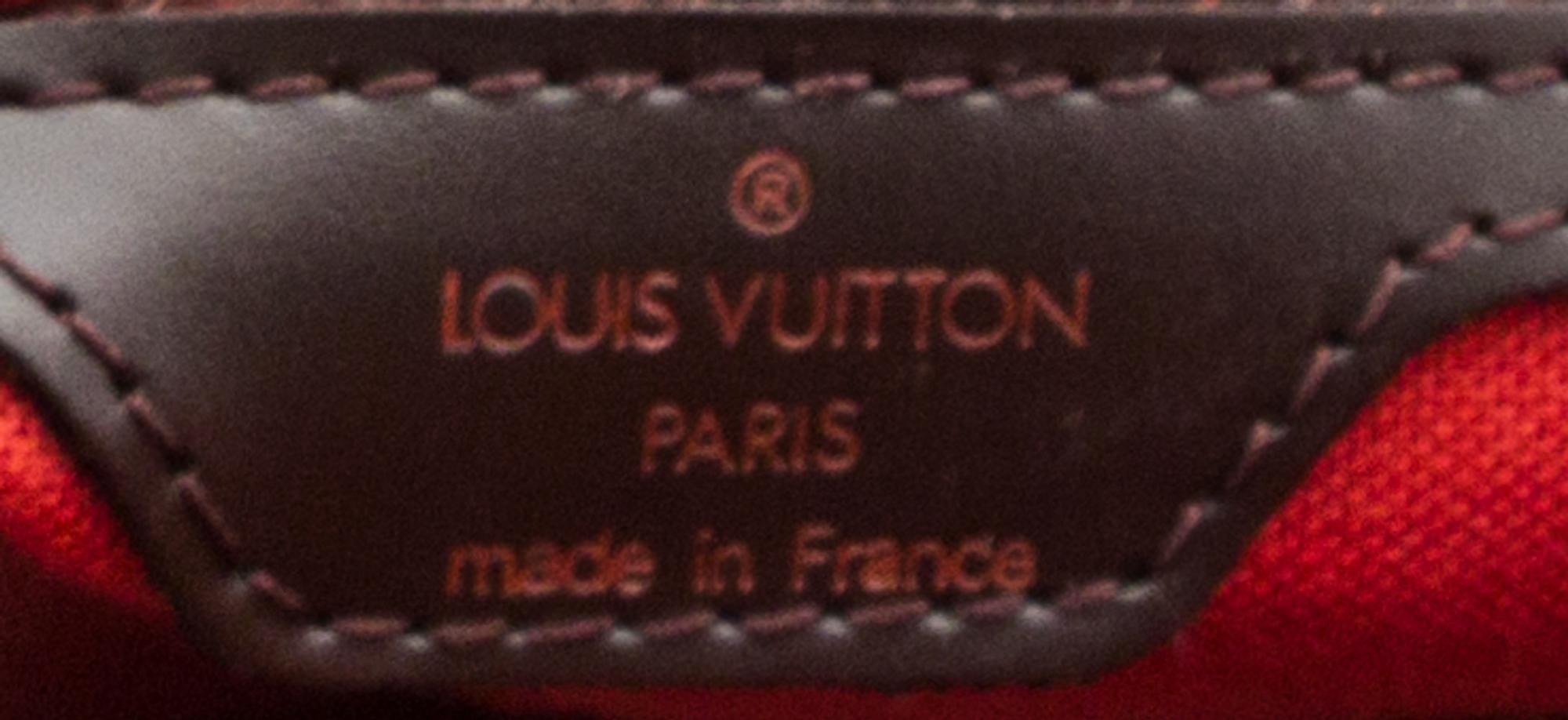 A Louis Vuitton Signature Leather Backpack, 11.5" x 12.5" x 4".