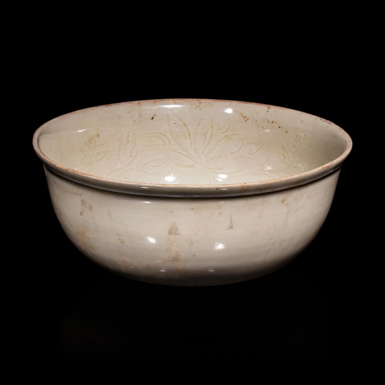 A Chinese Ding -Style Incised White Glazed Porcelain Bowl, Possibly Song Dynasty 或為宋 定窯白釉劃花鳳穿牡丹紋碗