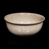 A Chinese Ding -Style Incised White Glazed Porcelain Bowl, Possibly Song Dynasty 或為宋 定窯白釉劃花鳳穿牡丹紋碗