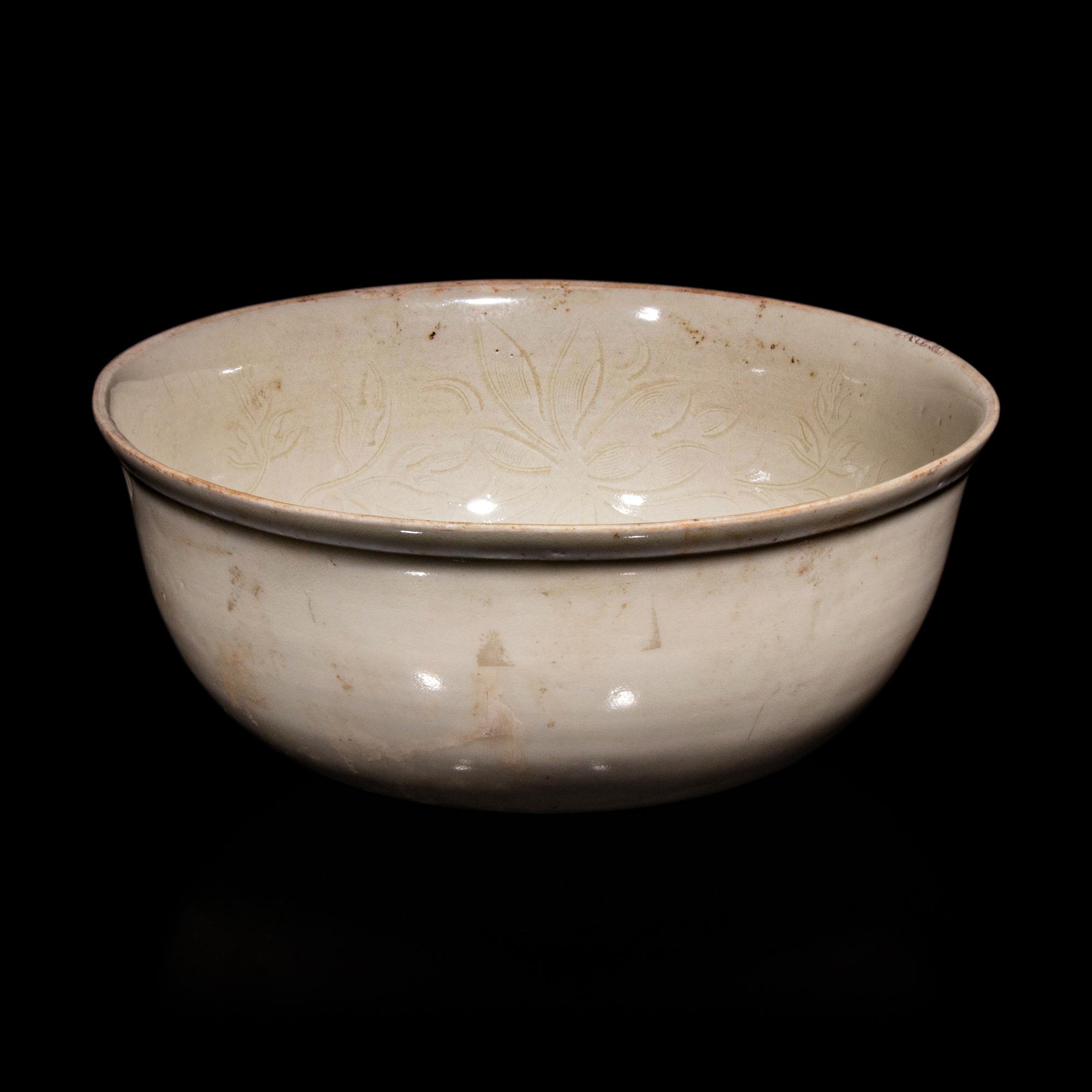 A Chinese Ding -Style Incised White Glazed Porcelain Bowl, Possibly Song Dynasty 或為宋 定窯白釉劃花鳳穿牡丹紋碗