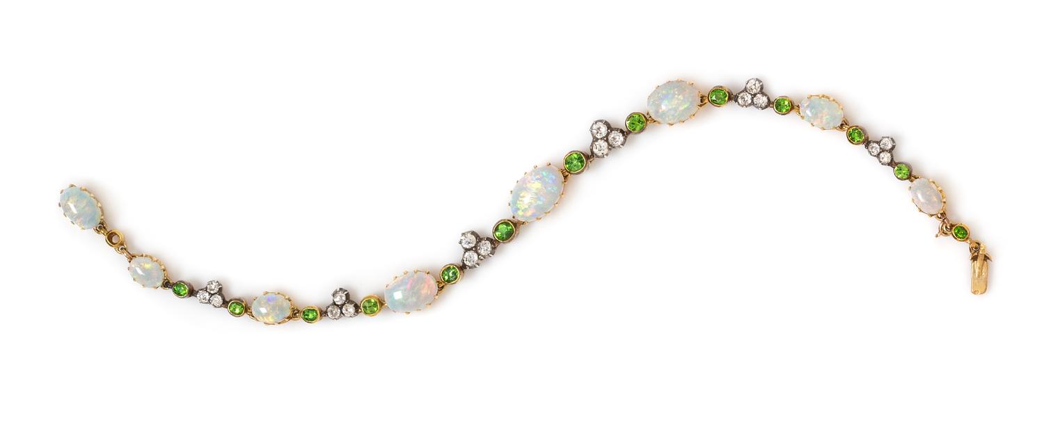 An Edwardian Silver Topped Yellow Gold, Opal, Diamond and Demantoid Garnet Bracelet, 8.10 dwts.