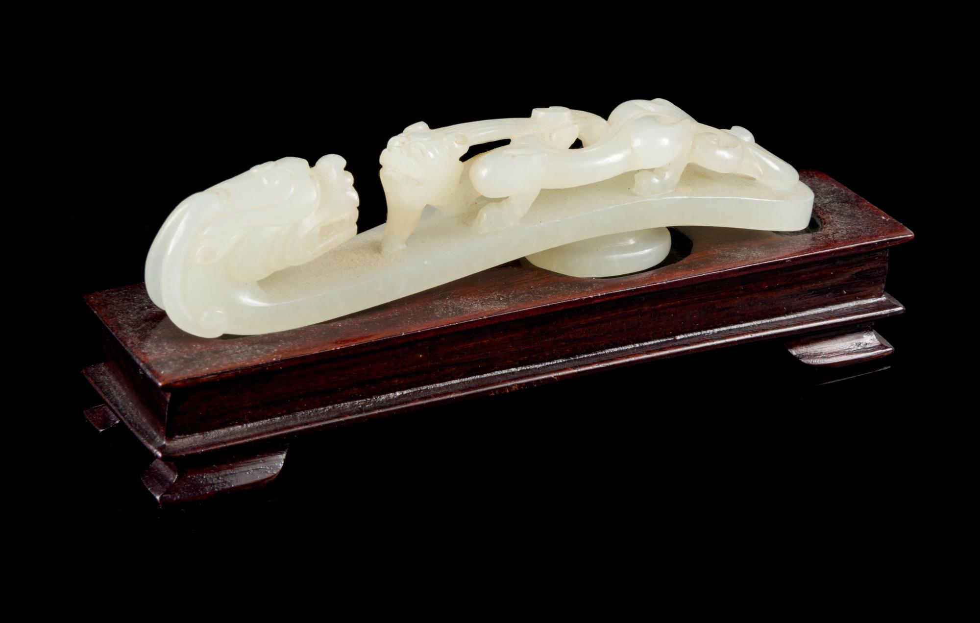 A Carved White Jade Belt Hook Length 3 3/4 inches. — 18TH/19TH CENTURY