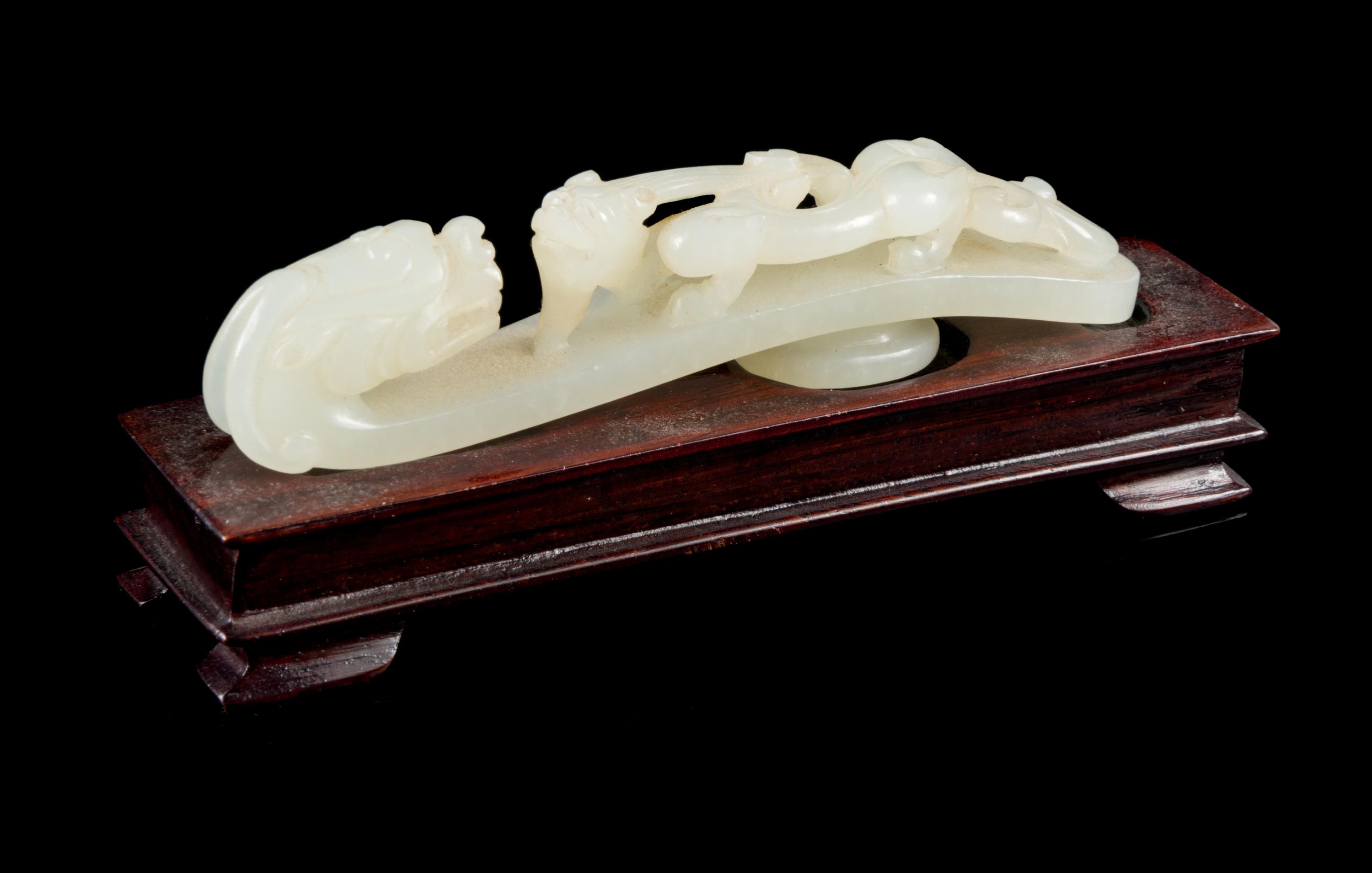 A Carved White Jade Belt Hook Length 3 3/4 inches. — 18TH/19TH CENTURY