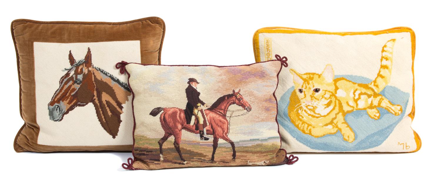 Three Needlepoint Pillows Largest length 17 inches. — 20TH CENTURY