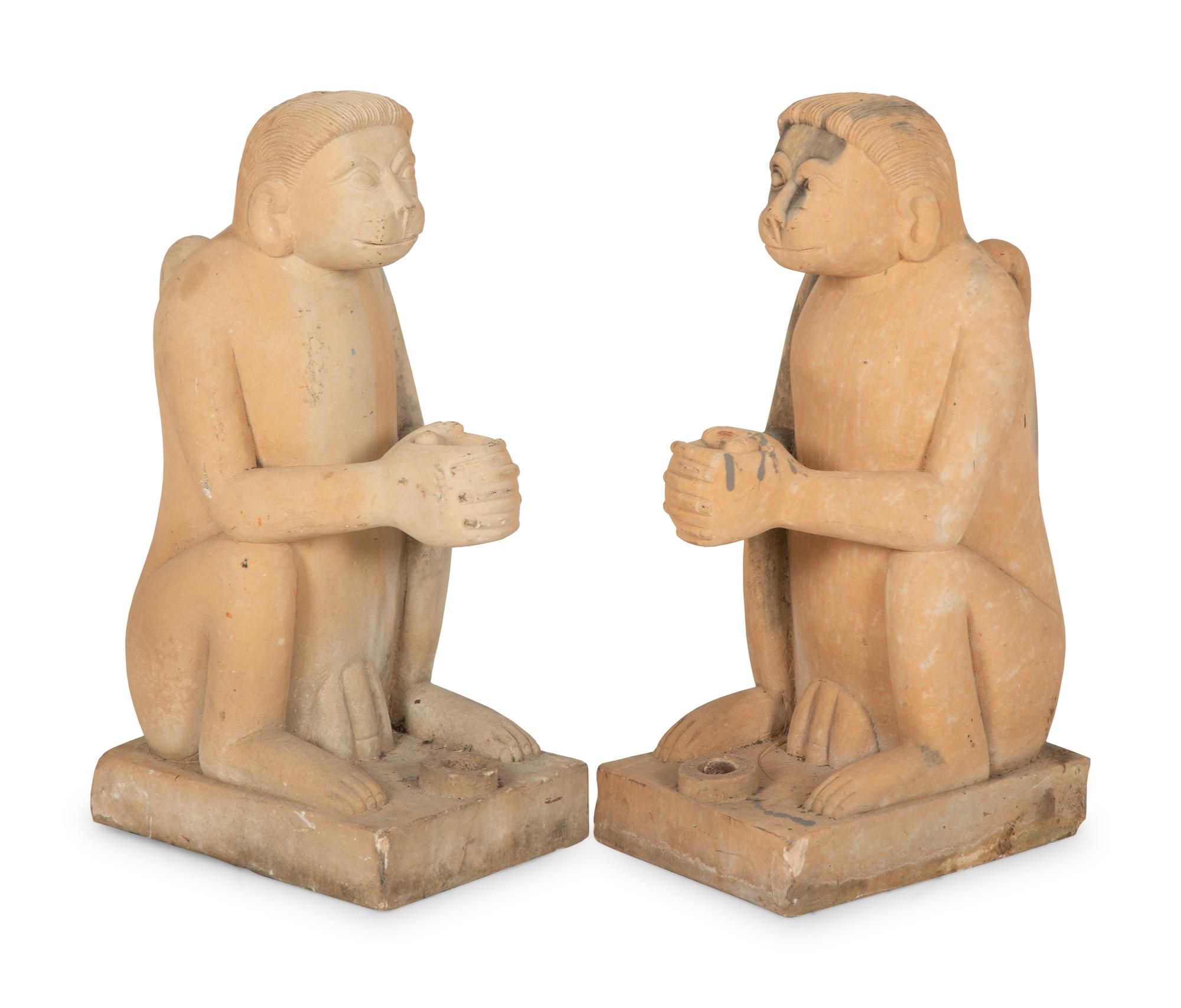 A Pair of Cast Stone Monkey-Form Torchere Holders