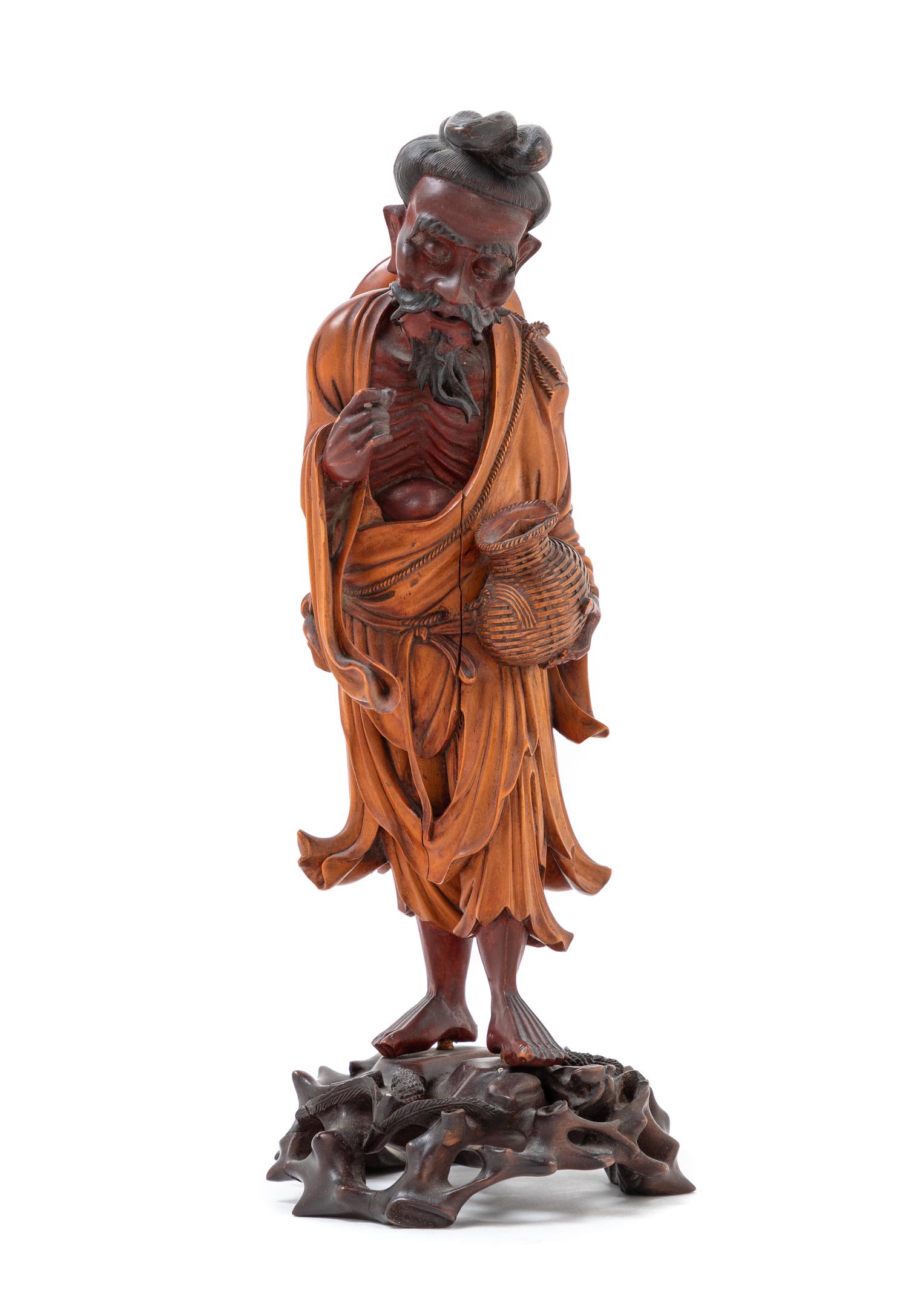 A Japanese Carved Wood Figure of a Fisherman