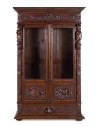A Dutch Baroque Revival Carved Oak Cupboard