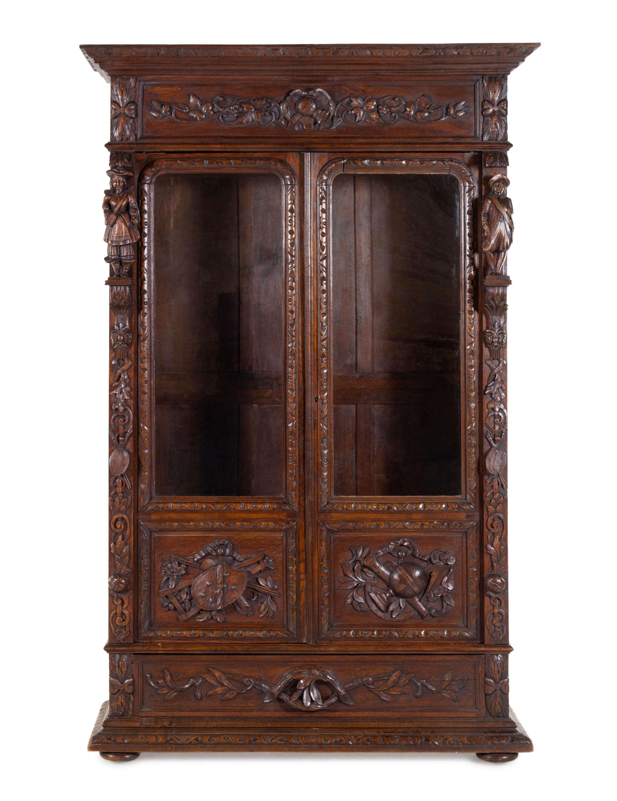 A Dutch Baroque Revival Carved Oak Cupboard