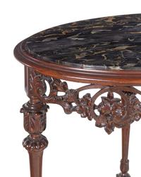 An Italian Carved Walnut Marble-Top Table