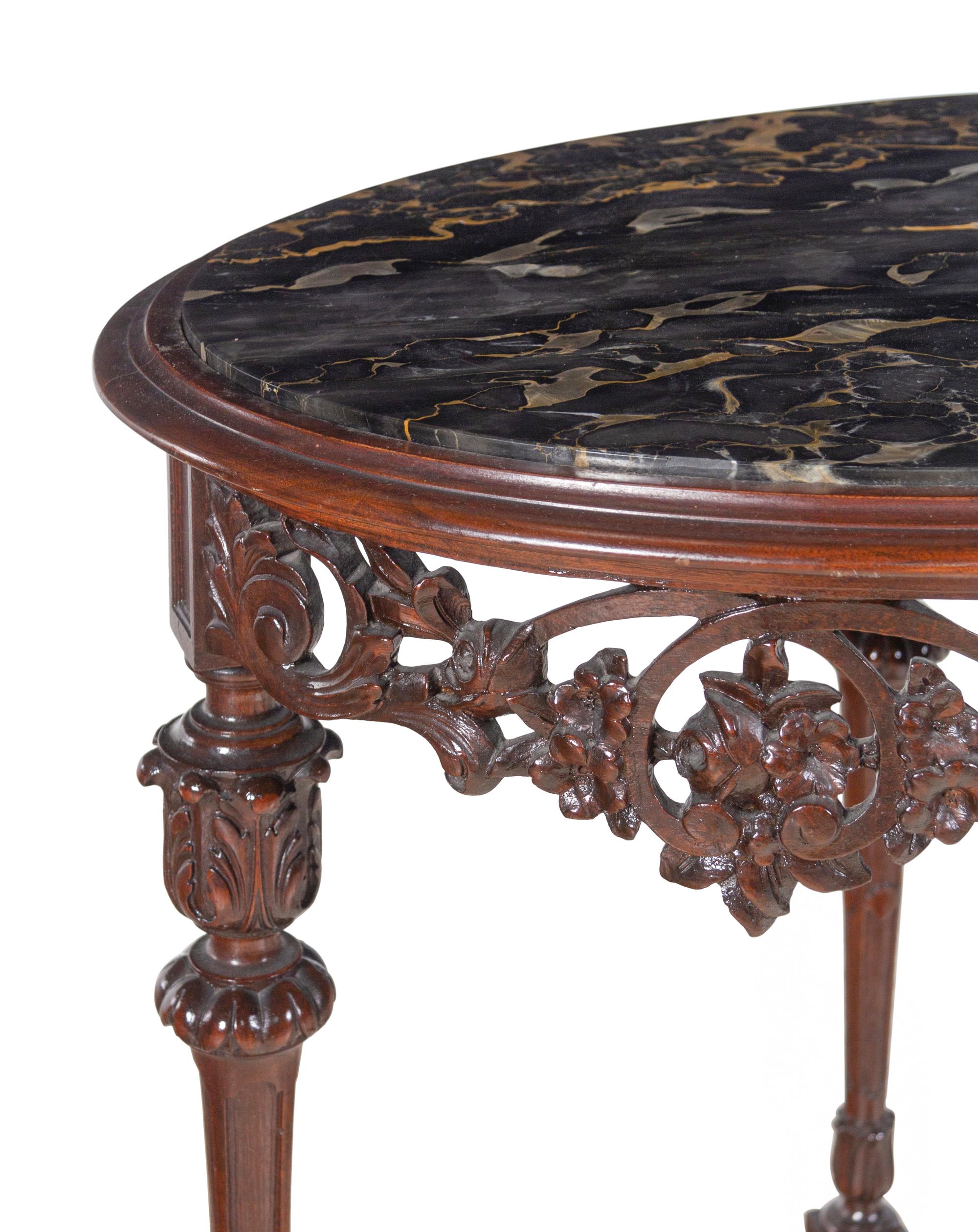An Italian Carved Walnut Marble-Top Table