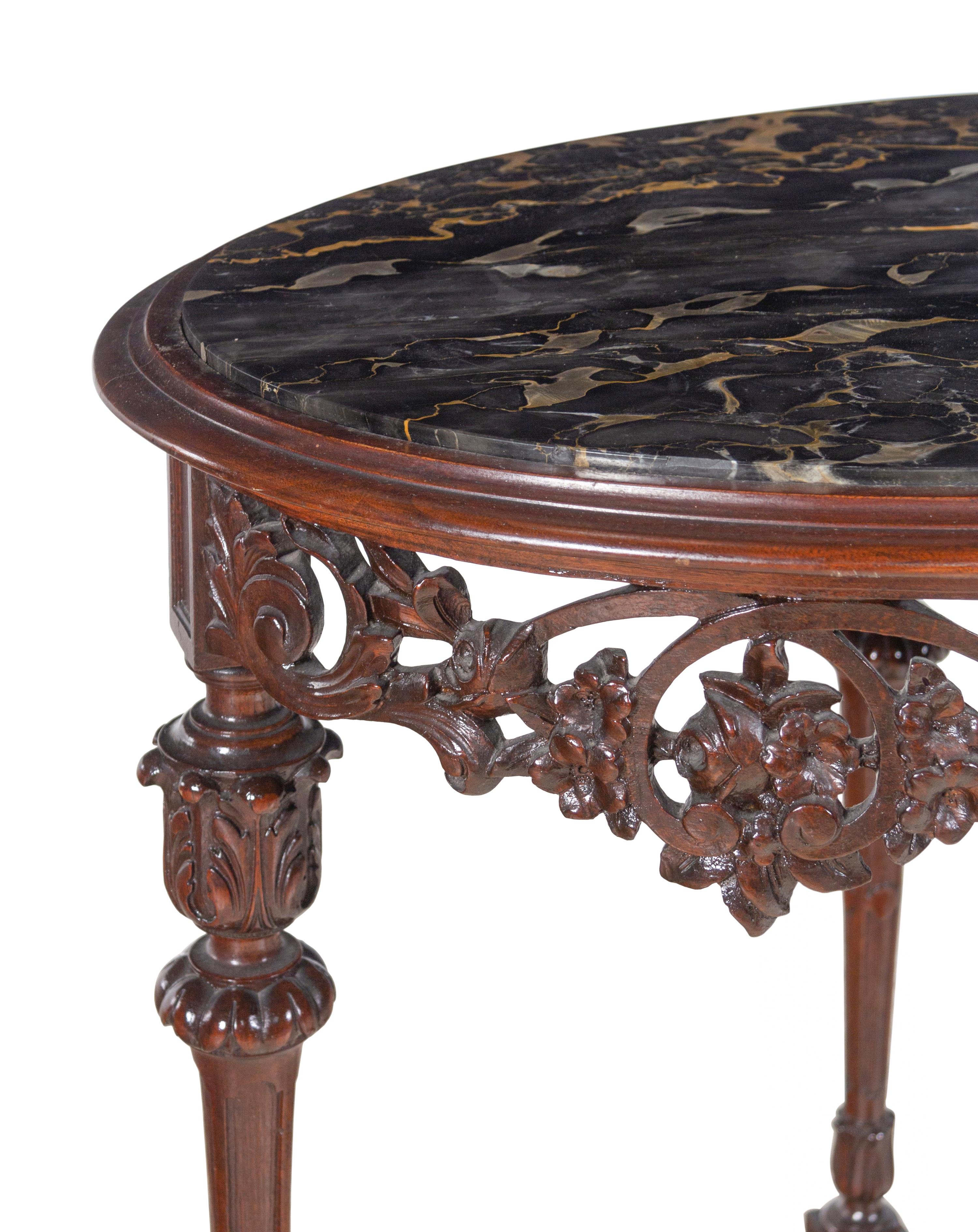 An Italian Carved Walnut Marble-Top Table