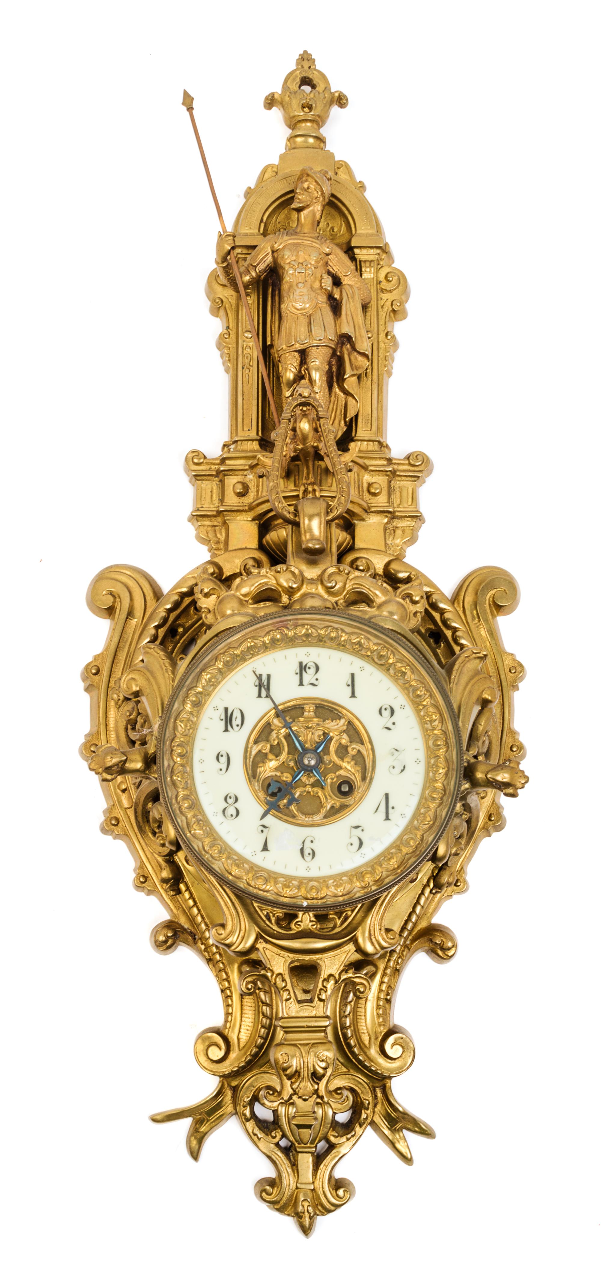 A Neoclassical Gilt Bronze Cartel Clock Height 30 1/2 inches. — 19TH CENTURY