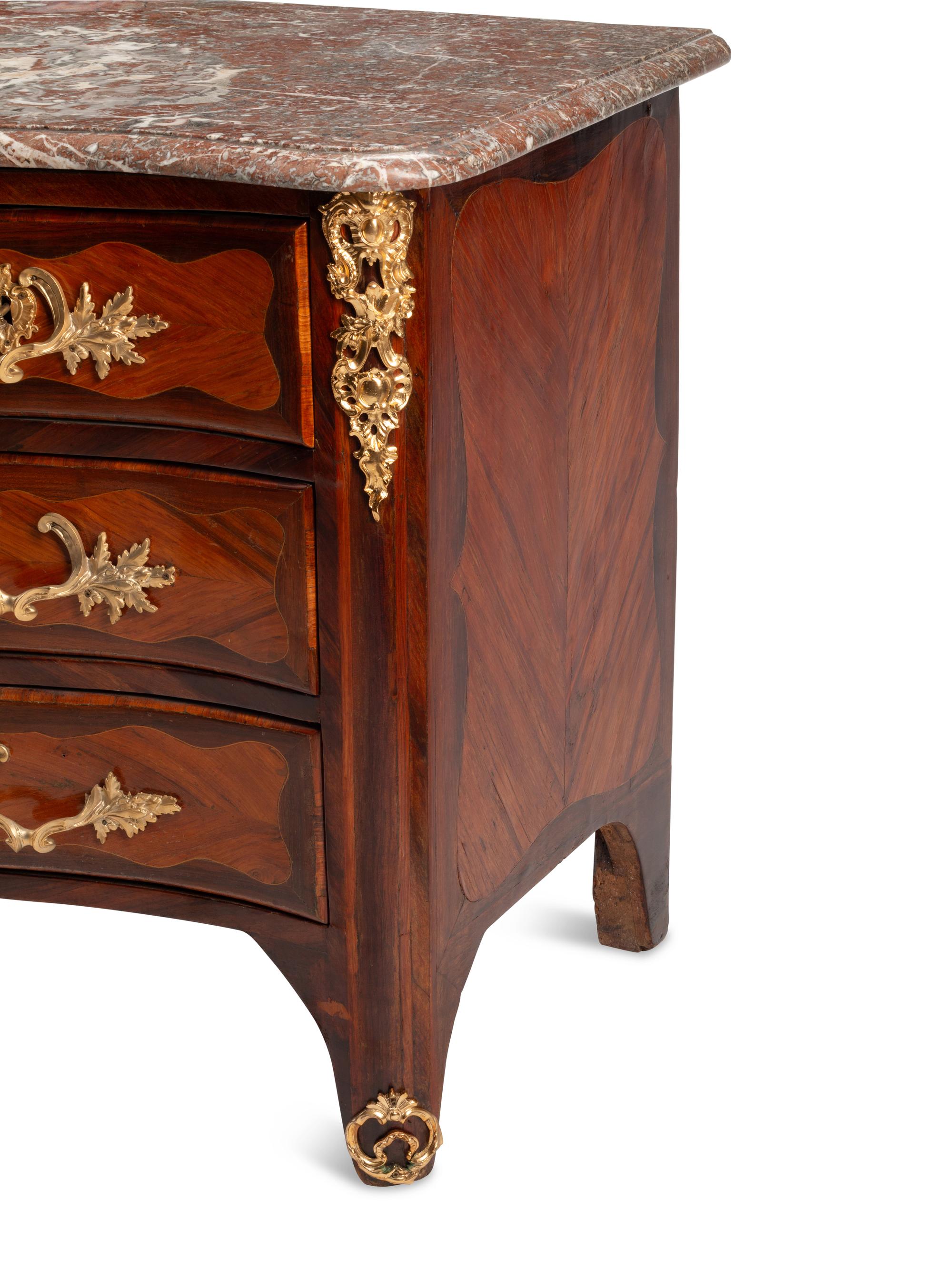 A Régence Gilt Bronze Mounted Kingwood and Tulipwood Parquetry Marble-Top Commode