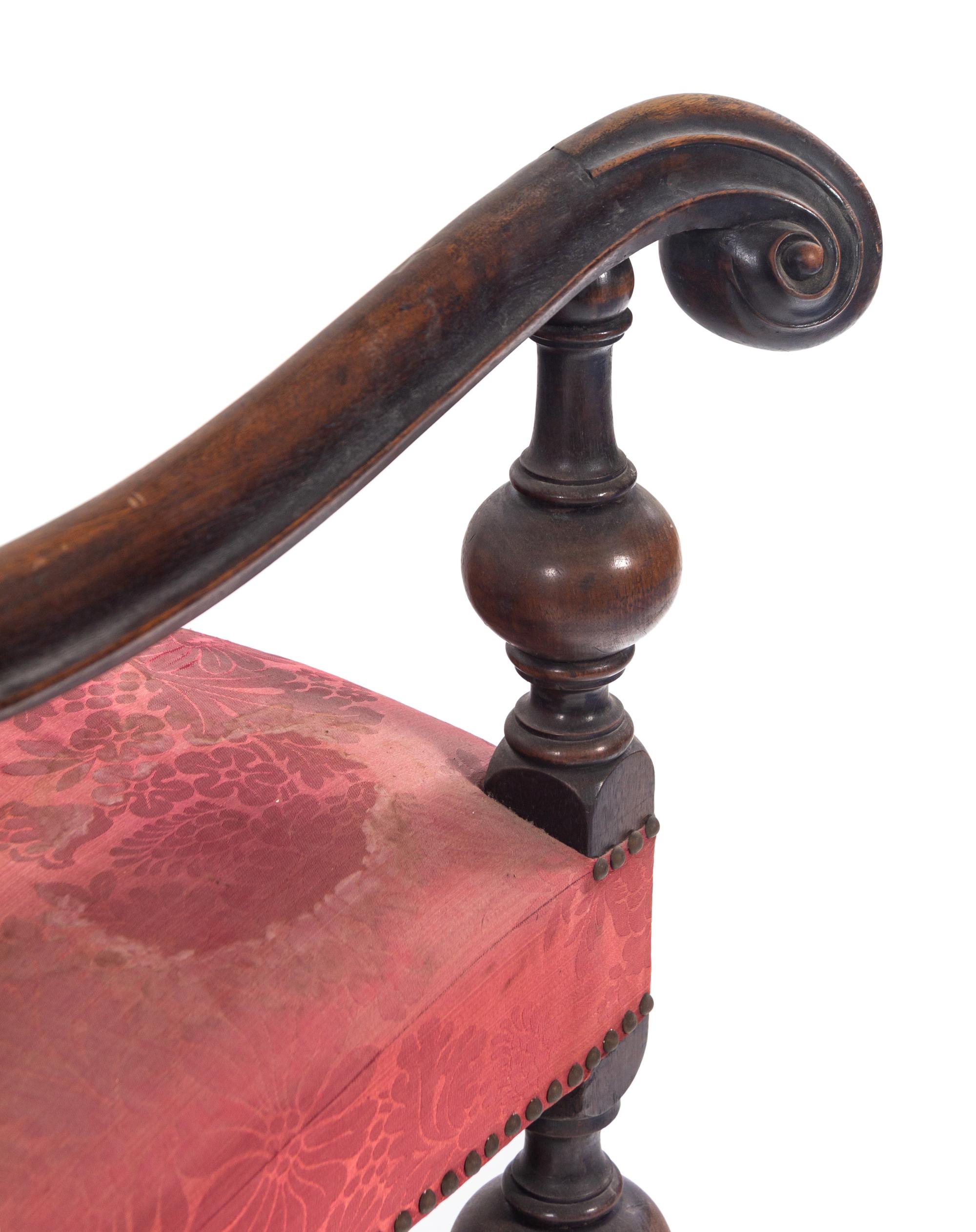 A Pair of William and Mary Style Carved Walnut Armchairs