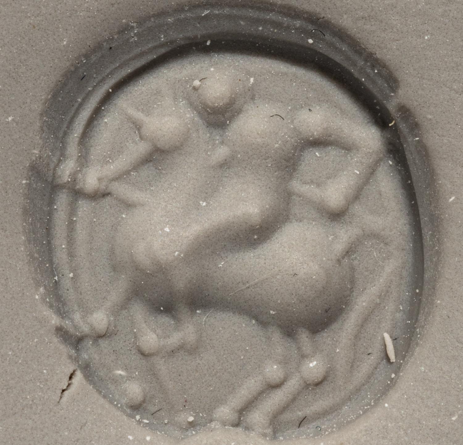 An Etruscan Carnelian Scarab with a Rider on Horseback