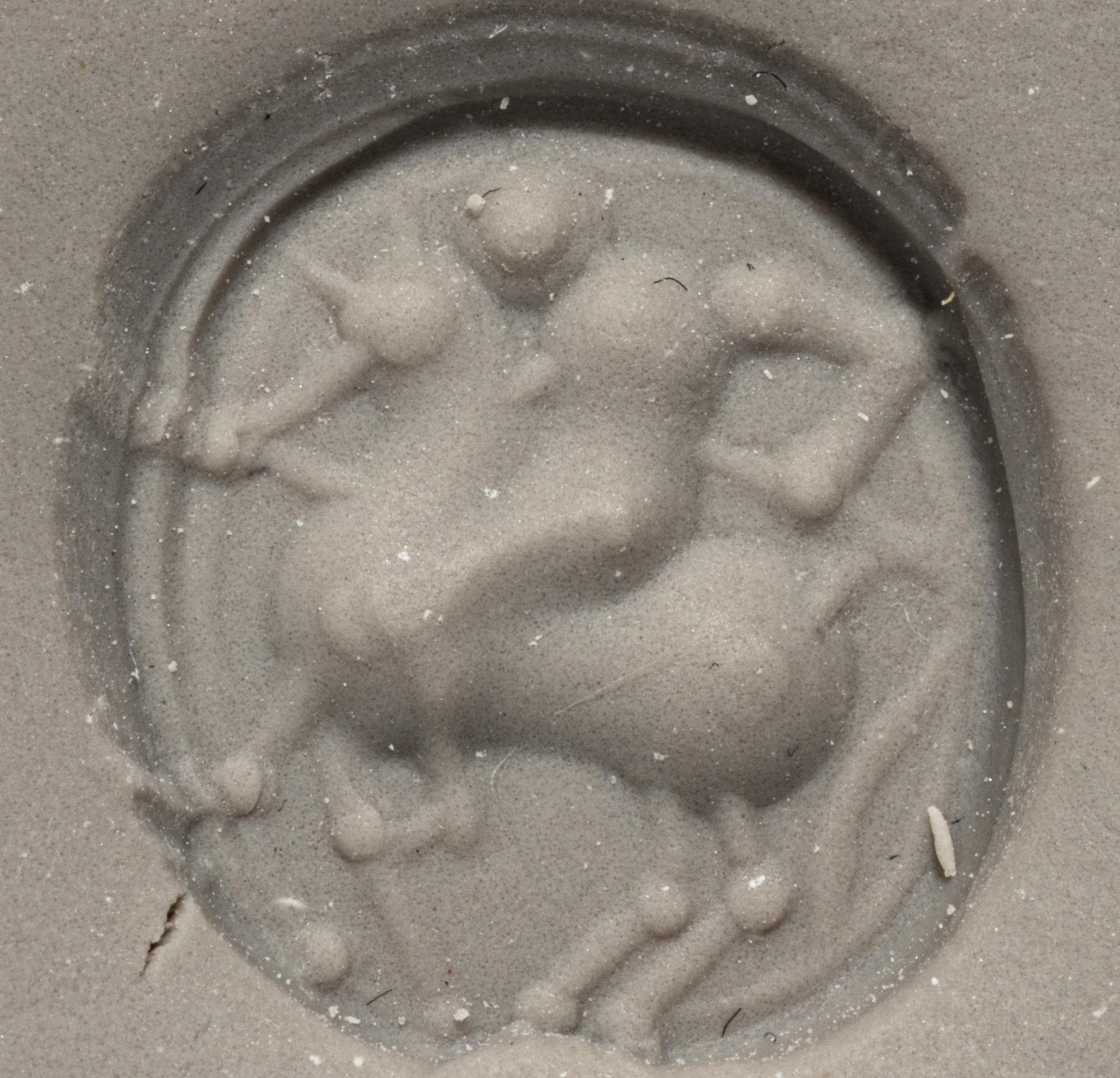 An Etruscan Carnelian Scarab with a Rider on Horseback