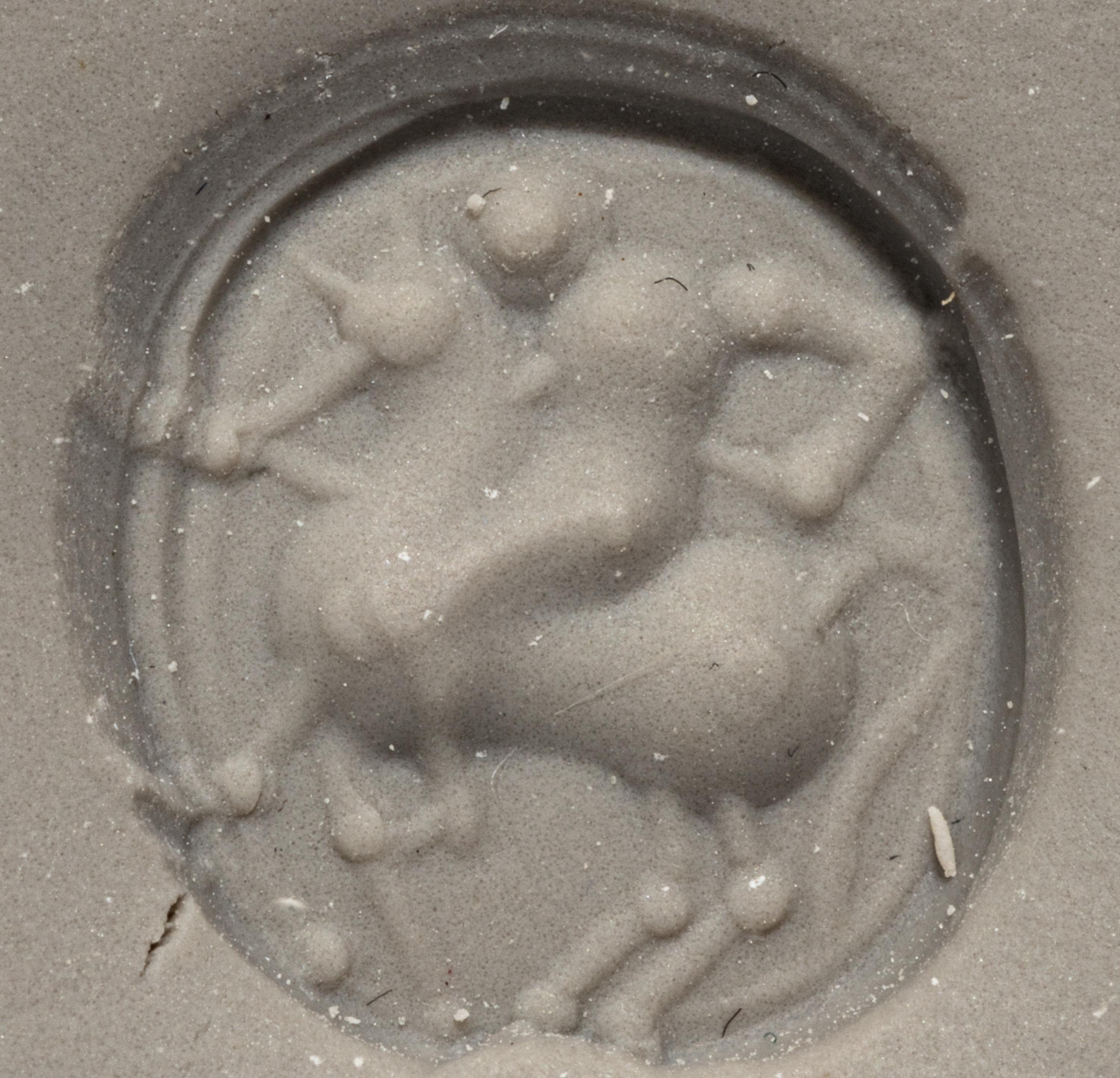 An Etruscan Carnelian Scarab with a Rider on Horseback