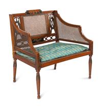 An Edwardian Painted and Caned Armchair