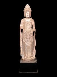 A Chinese Carved Sandstone Buddha with Remnants of Polychrome Decoration