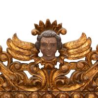 A Spanish Baroque Style Painted and Giltwood Mirror