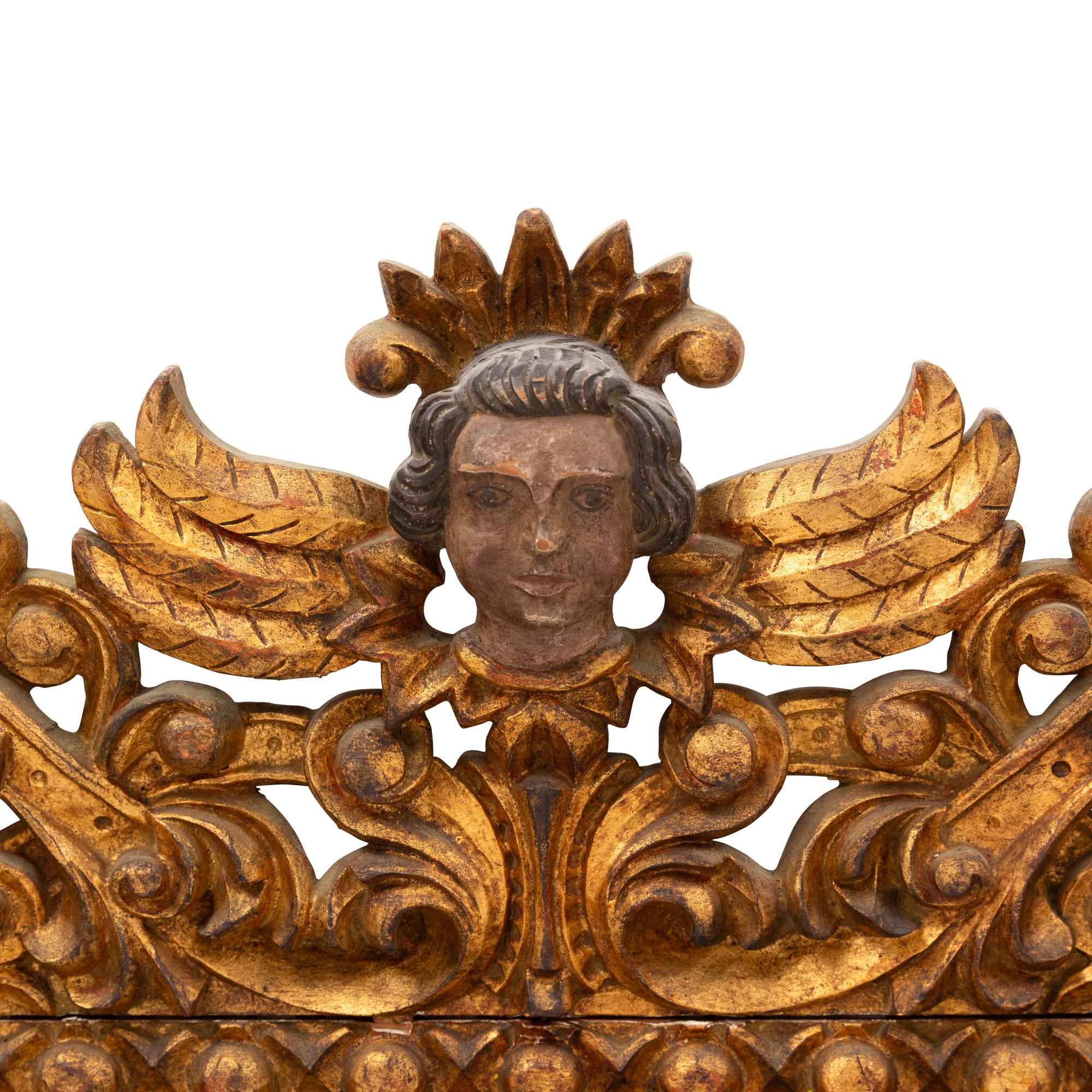 A Spanish Baroque Style Painted and Giltwood Mirror