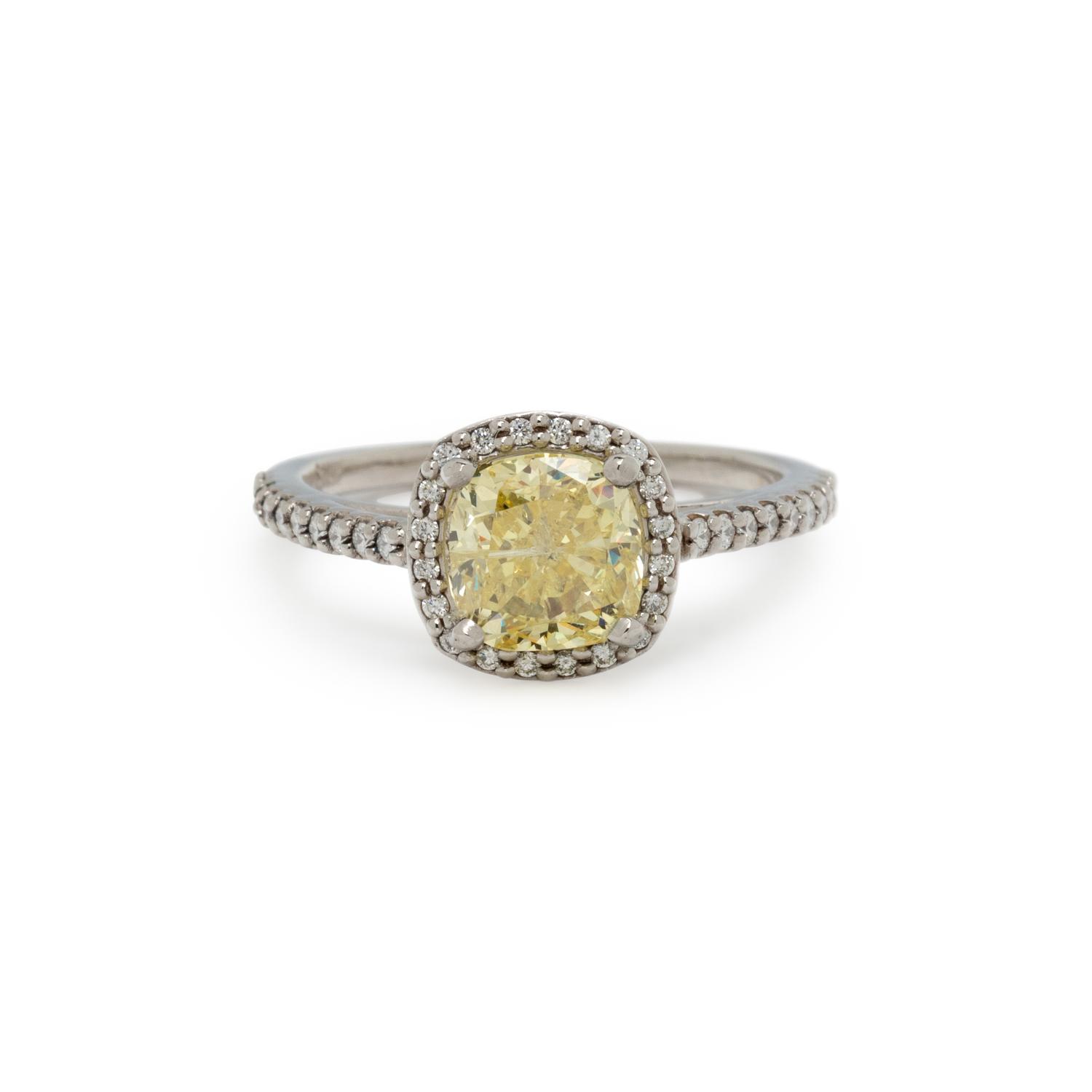 FANCY INTENSE YELLOW DIAMOND AND DIAMOND RING