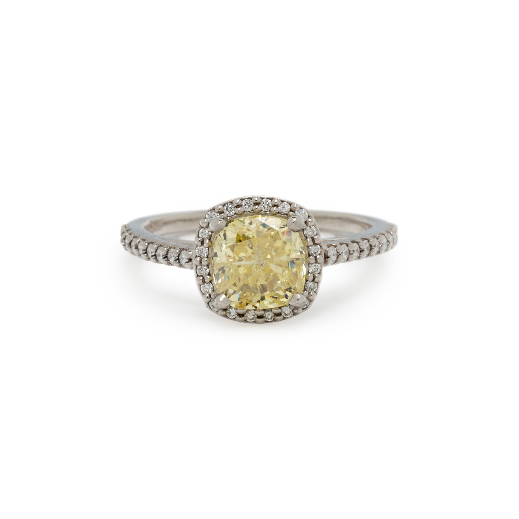 FANCY INTENSE YELLOW DIAMOND AND DIAMOND RING