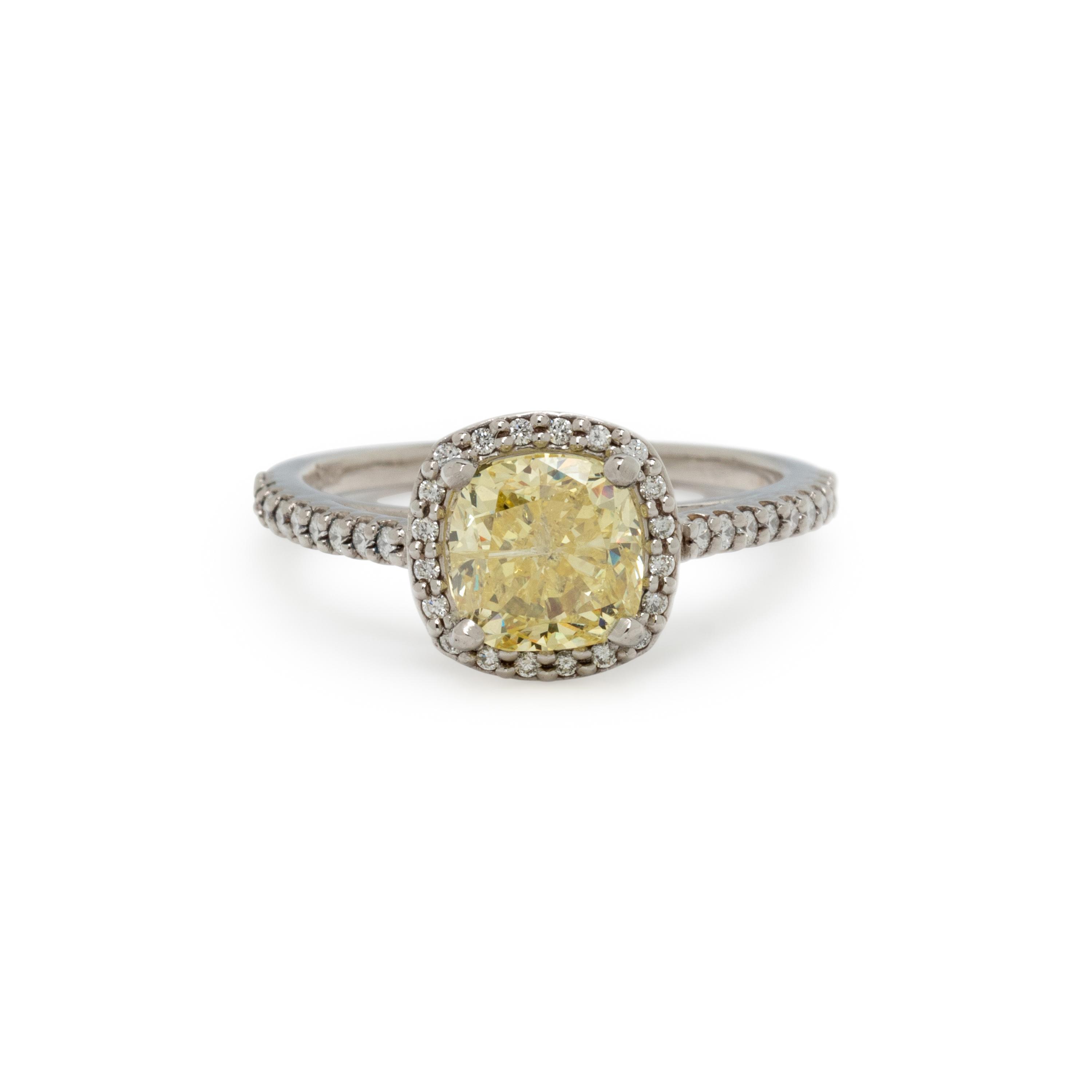 FANCY INTENSE YELLOW DIAMOND AND DIAMOND RING