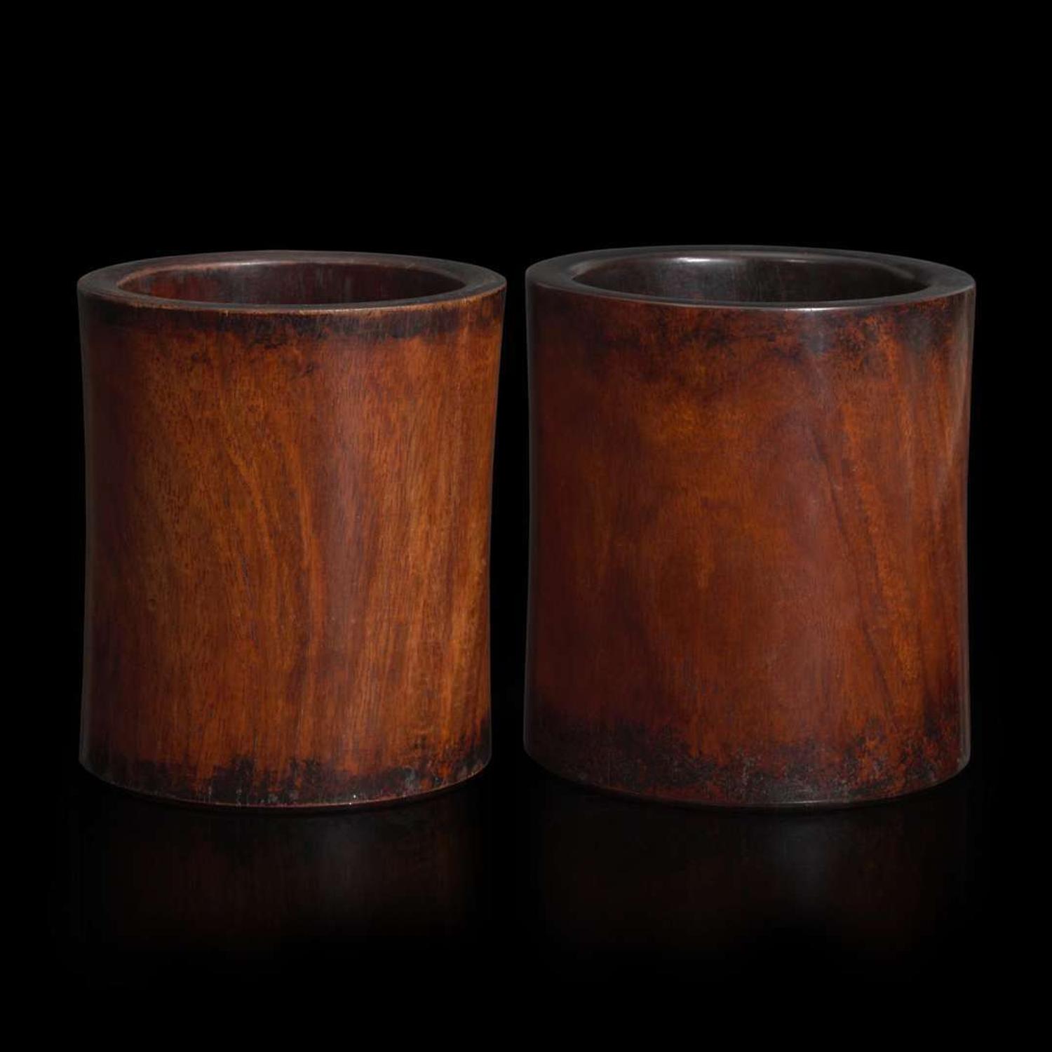 Two Chinese “huanghuali” brush pots 黄花梨笔筒两件