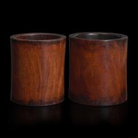 Two Chinese “huanghuali” brush pots 黄花梨笔筒两件