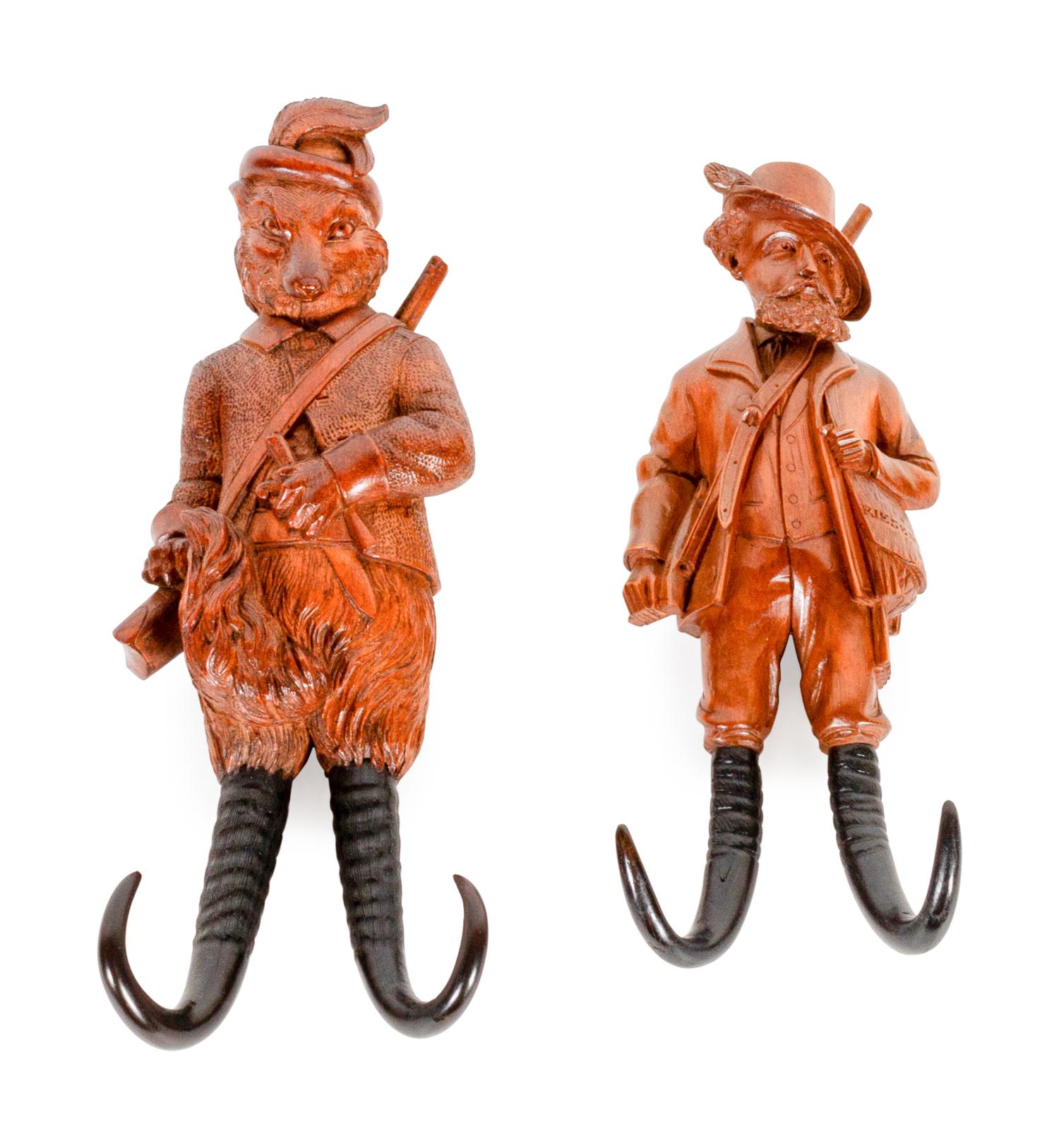 Two Black Forest Carved Wood Whip Hooks